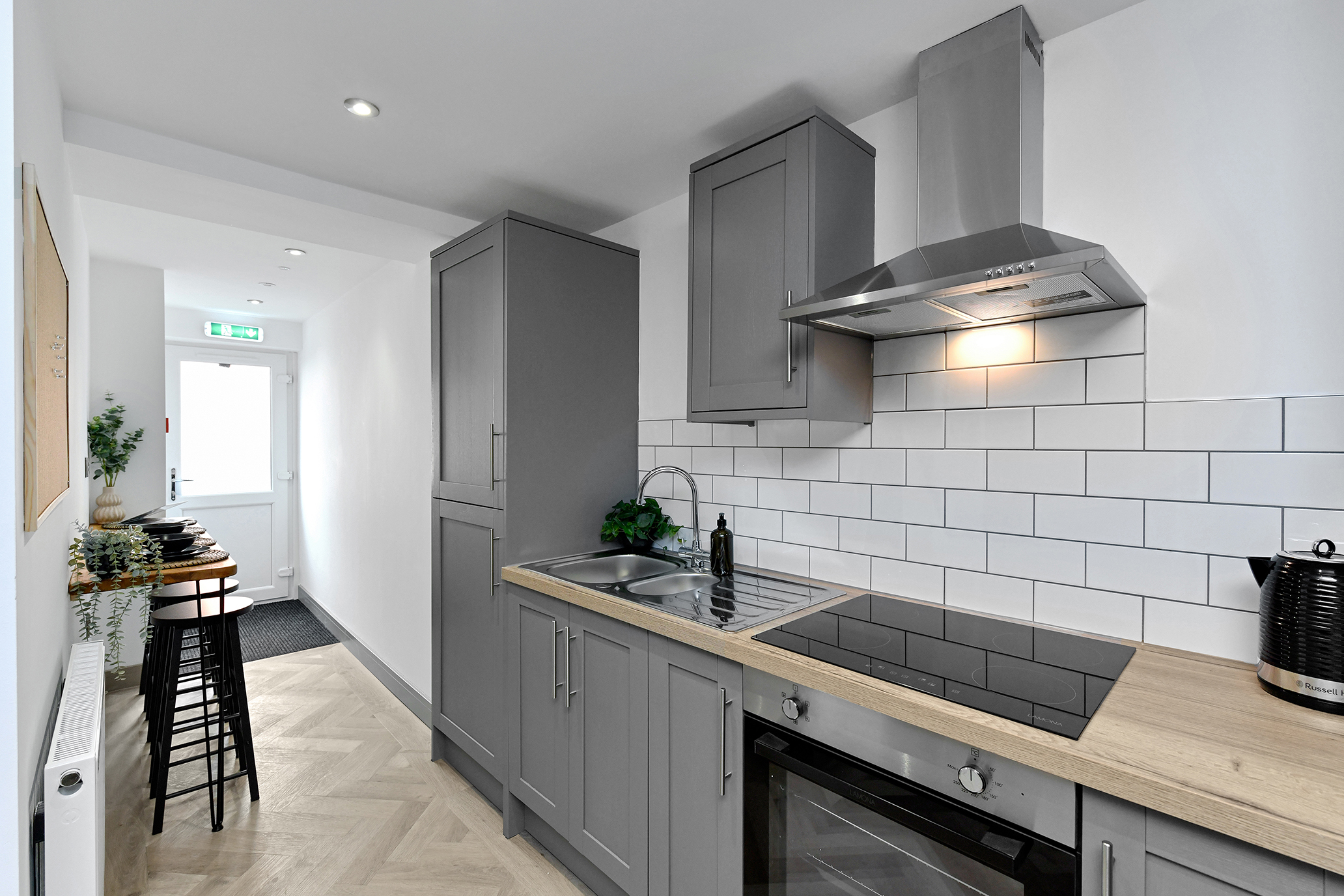 Communal kitchen and breakfast area at 64 Derbyshire Lane
