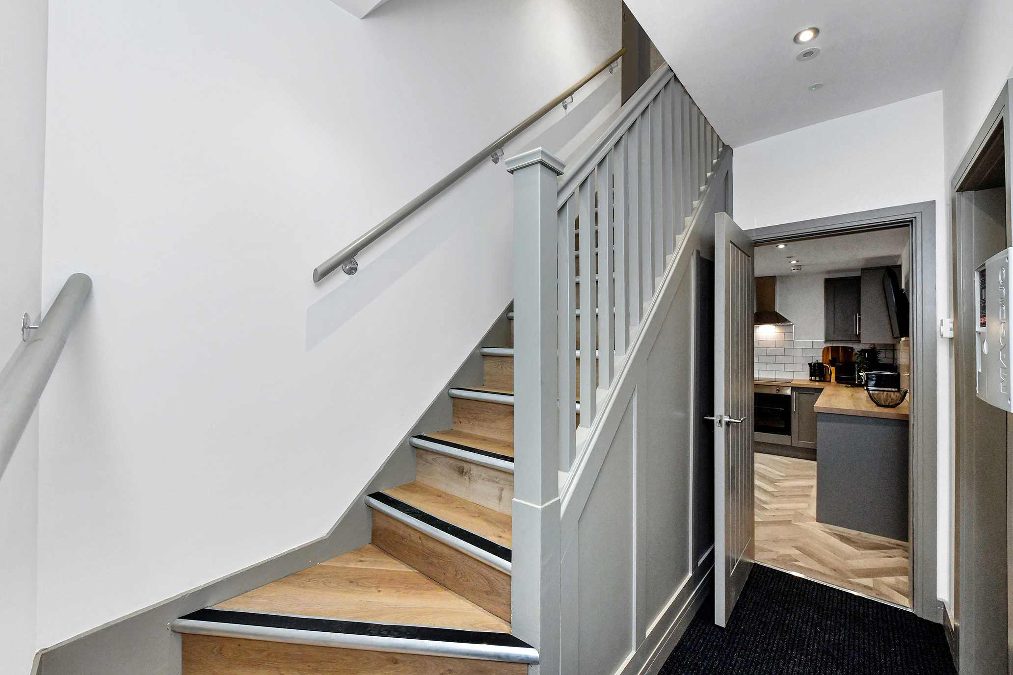 Communal stairs and kitchen approach at 64 Derbyshire Lane